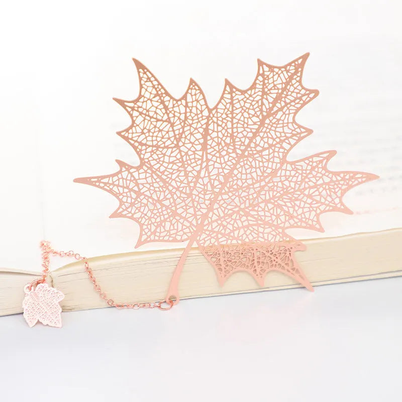 Brass metal bookmark with hollow leaf pattern design and rose gold tassel