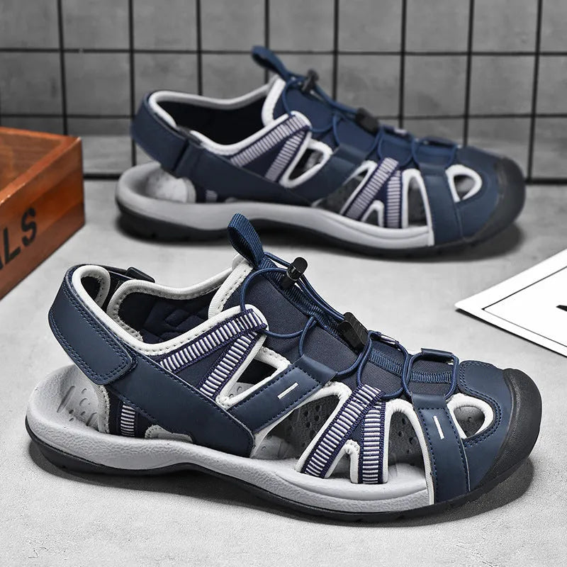 Men's blue mesh velcro sports shoe with rubber sole and toe holder design on a white background