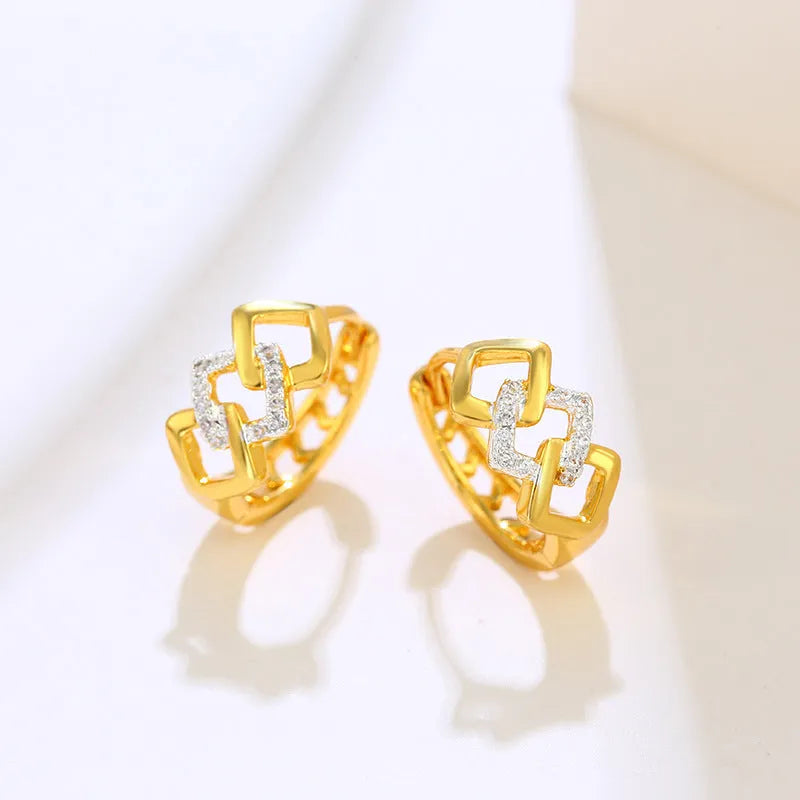 Gold geometric hollow out earrings with electroplated finish at ear clip area