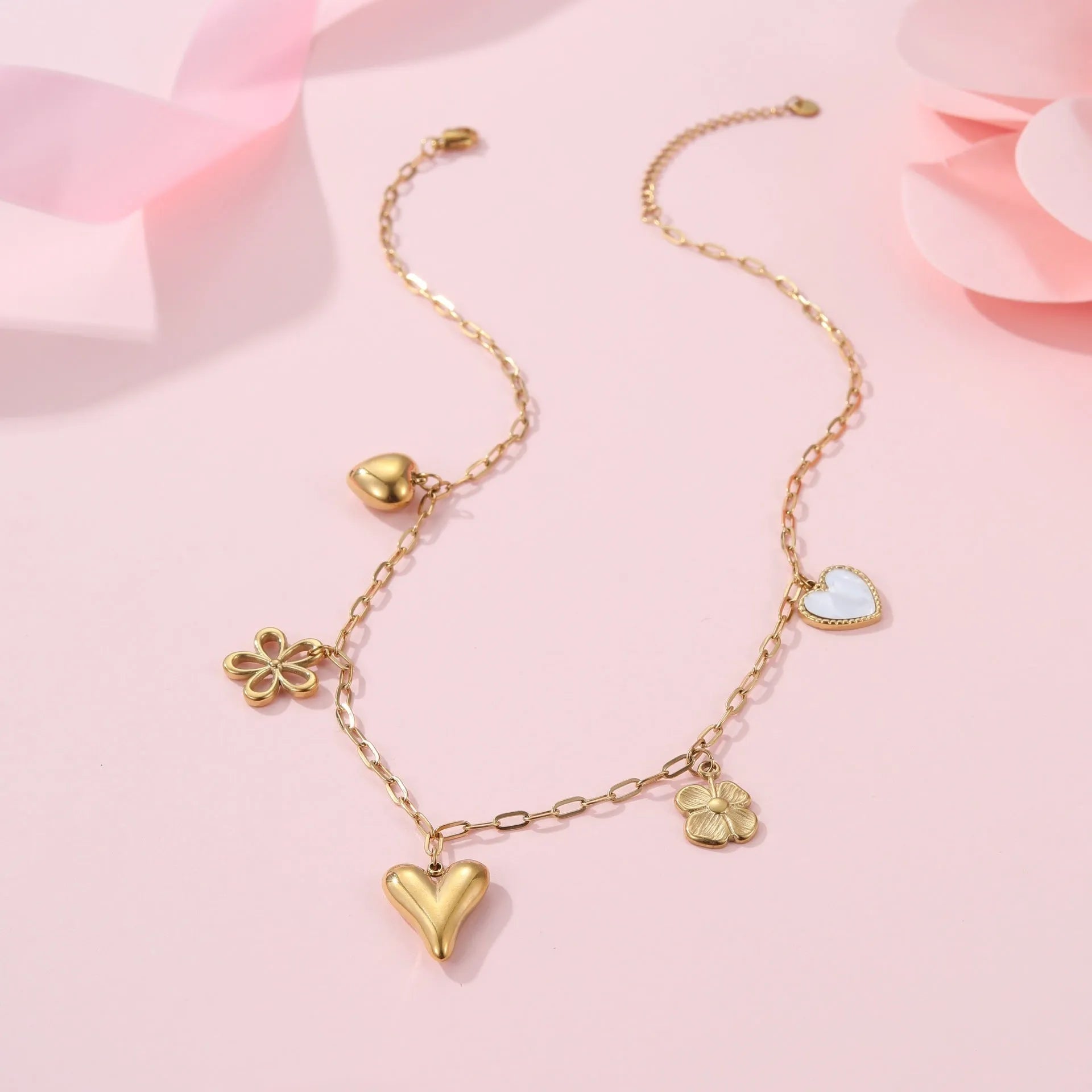Gold-plated stainless steel necklace showing geometric sun pendant on an adjustable chain.