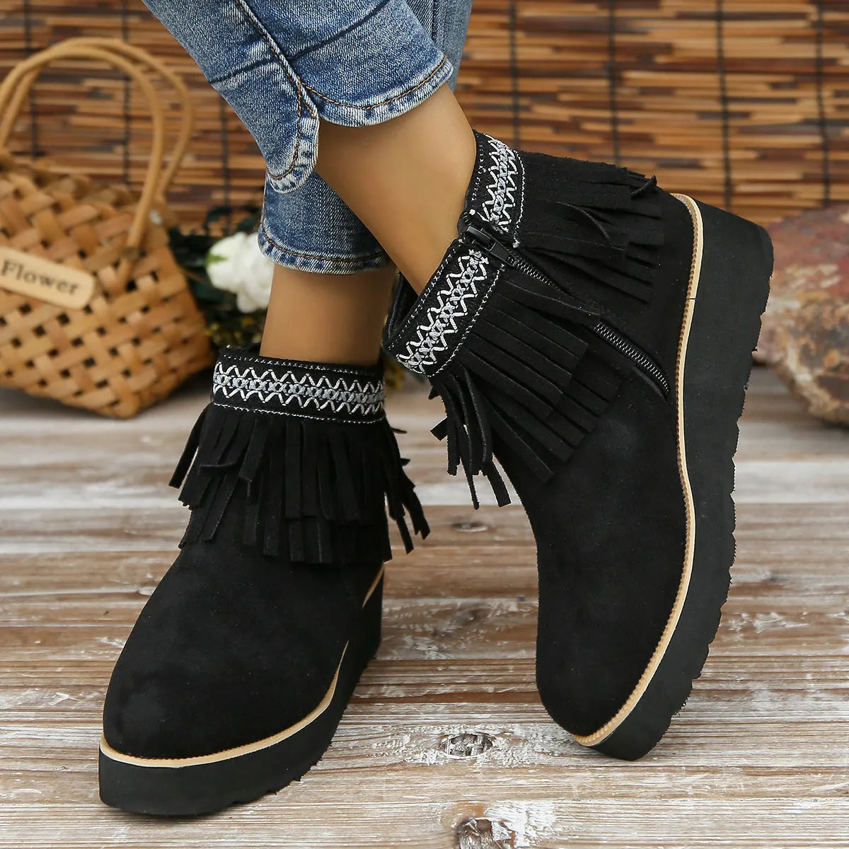 Women's dark brown suede wedge ankle boots with a side zipper and decorative tassel.
