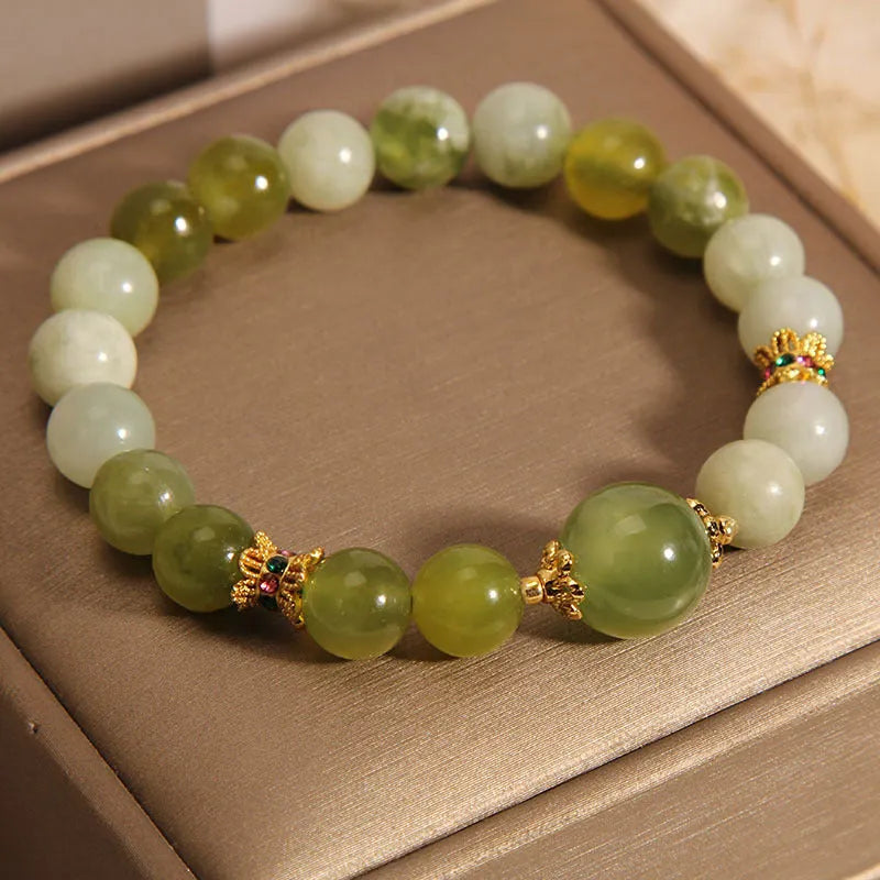 Xiuyan jade green Mori-style women's bracelet on a wrist.