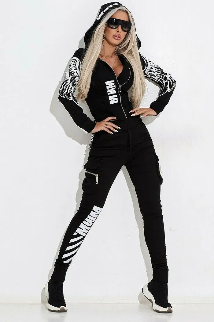 Black women's casual suit with hooded zip-up jacket and matching printed trousers on a hanger.