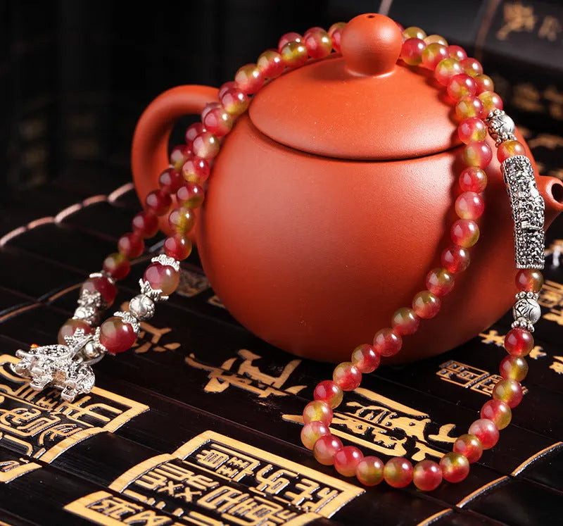 Handmade natural watermelon crystal bracelet with Chinese knot closure in geometric national style design