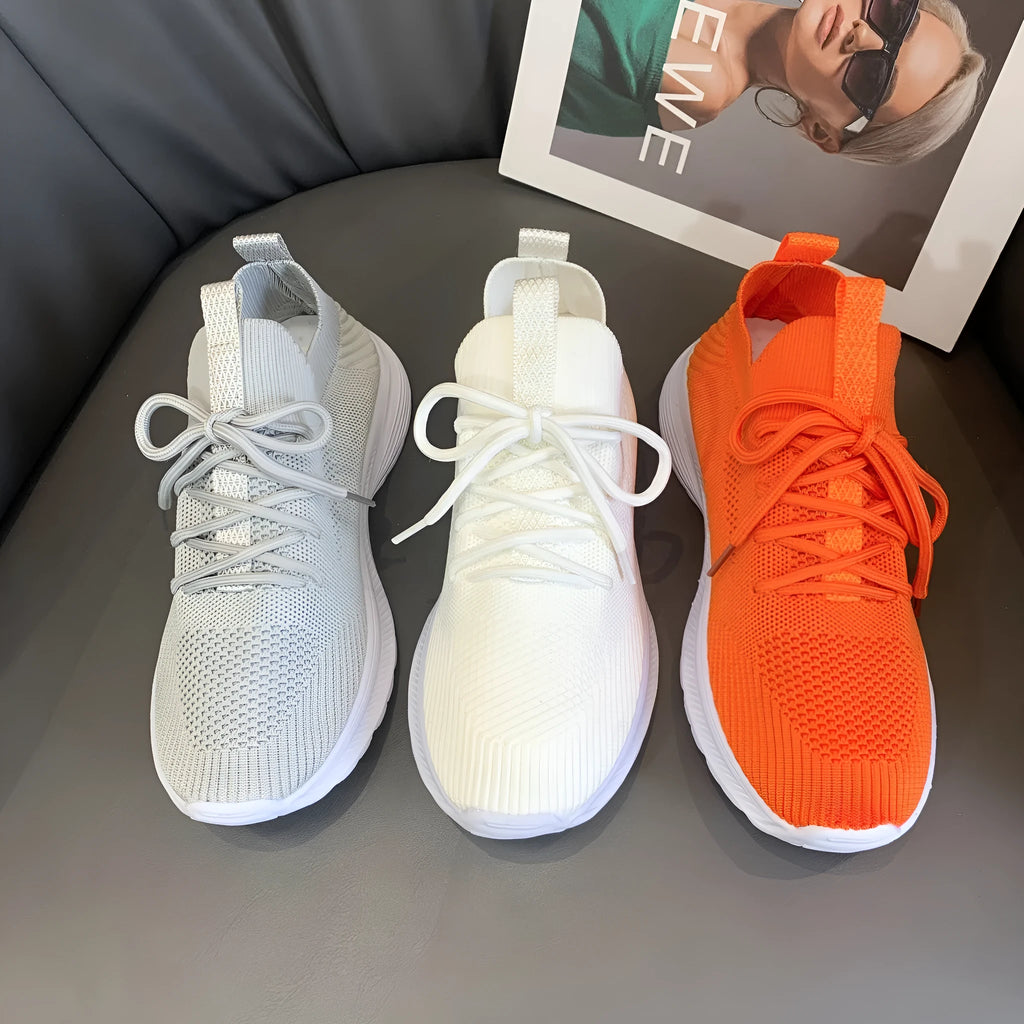 Women's mesh running shoes in Creamy White colour with Flyknit upper and rubber sole