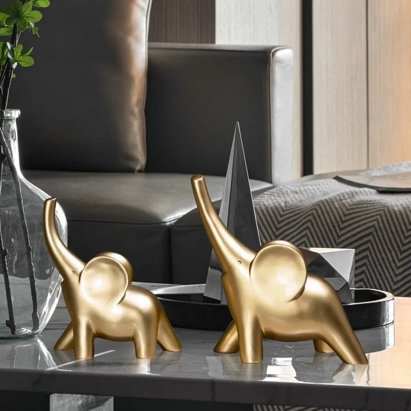 Modern resin elephant ornament in rose gold colour displayed on wooden surface