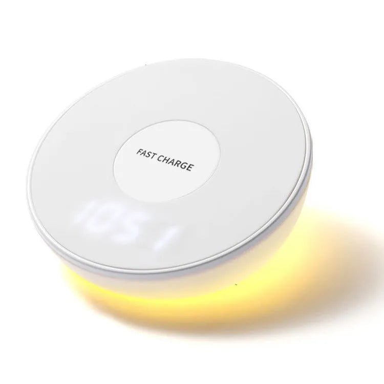 White wireless phone charger with LED clock display showing time, 115mm wide with three control buttons