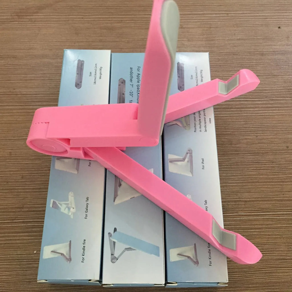 Black foldable tablet holder standing upright with a tablet device resting on its non-slip rubber surface.
