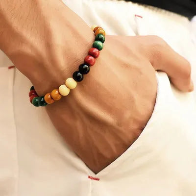 Unisex ethnic-style beaded bracelet made from natural lava stone on a wrist.