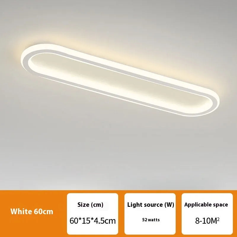 Slim aluminium strip ceiling lamp with PVC diffuser in a minimalist design for corridor or bedroom lighting.