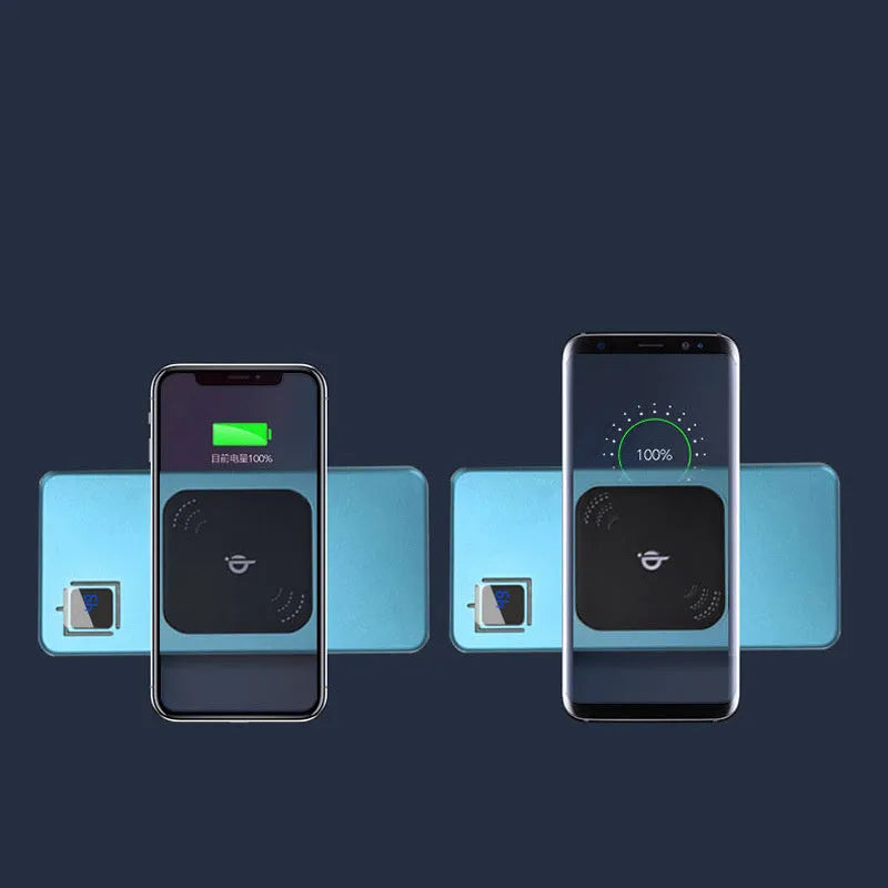 Black portable power bank with LCD display showing battery percentage, next to a smartphone for scale.