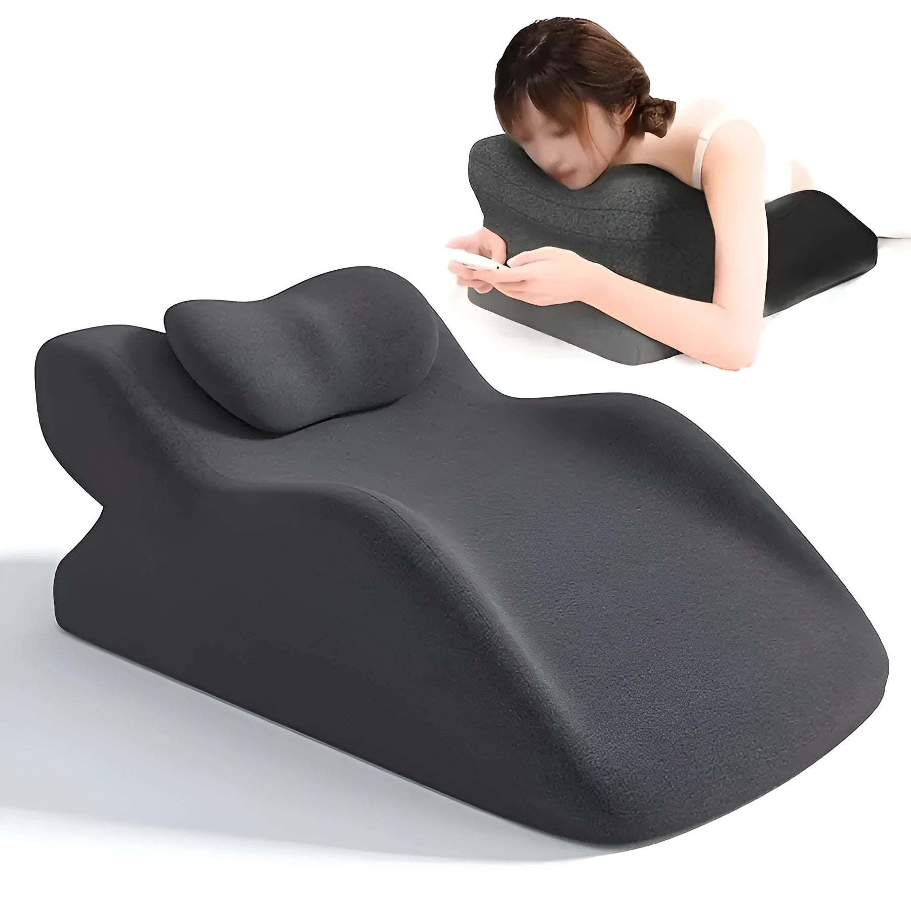 A stomach sleeper pillow shown in light grey, designed for reading or phone use in a prone position.