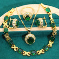 Gold-plated necklace, earrings, ring and bracelet set with blue cubic zirconia stones.