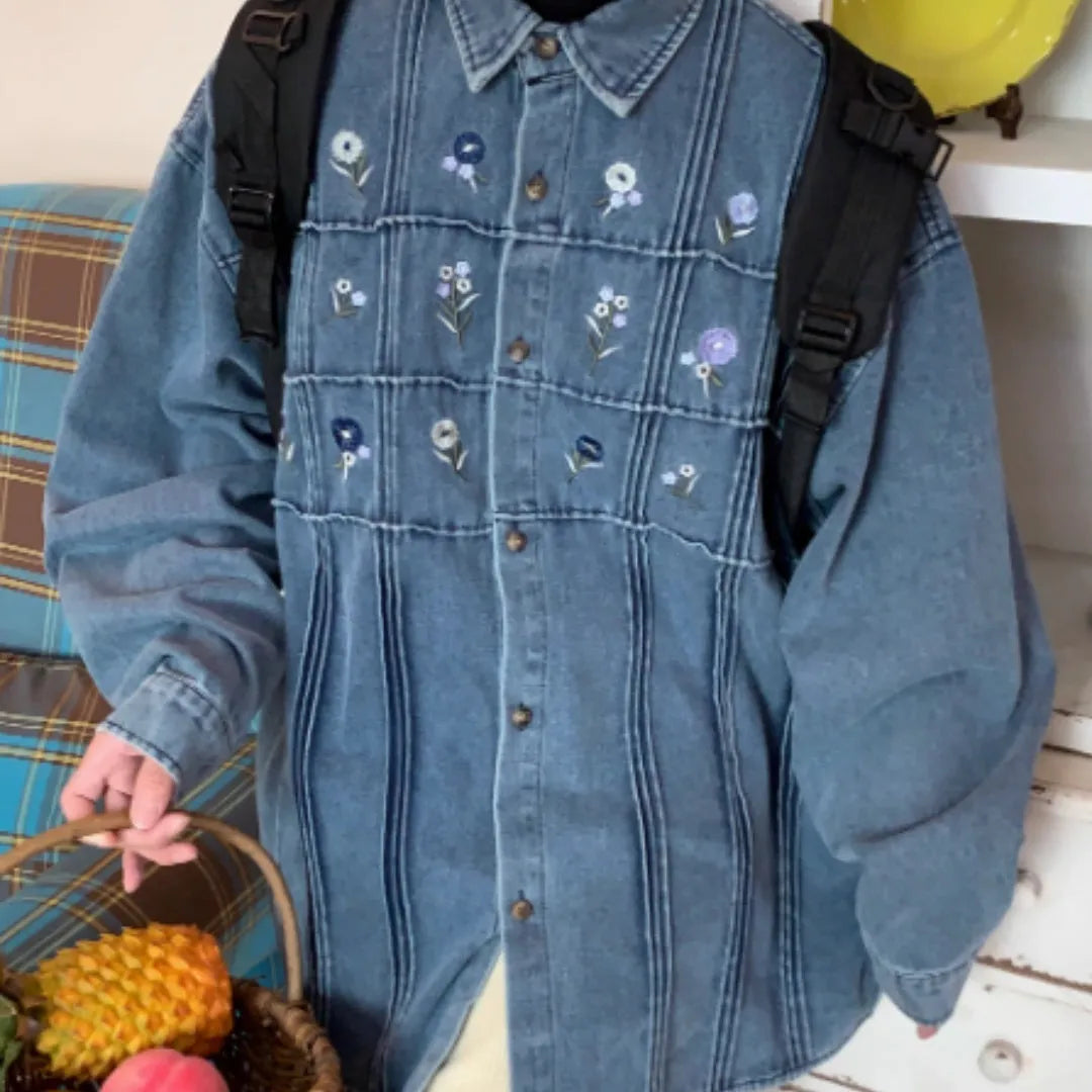 Vintage washed blue denim shirt with small floral print and pleated detailing on long sleeves