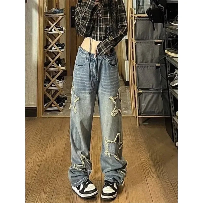 Blue wide-leg high-waist denim trousers with straight leg design laid flat