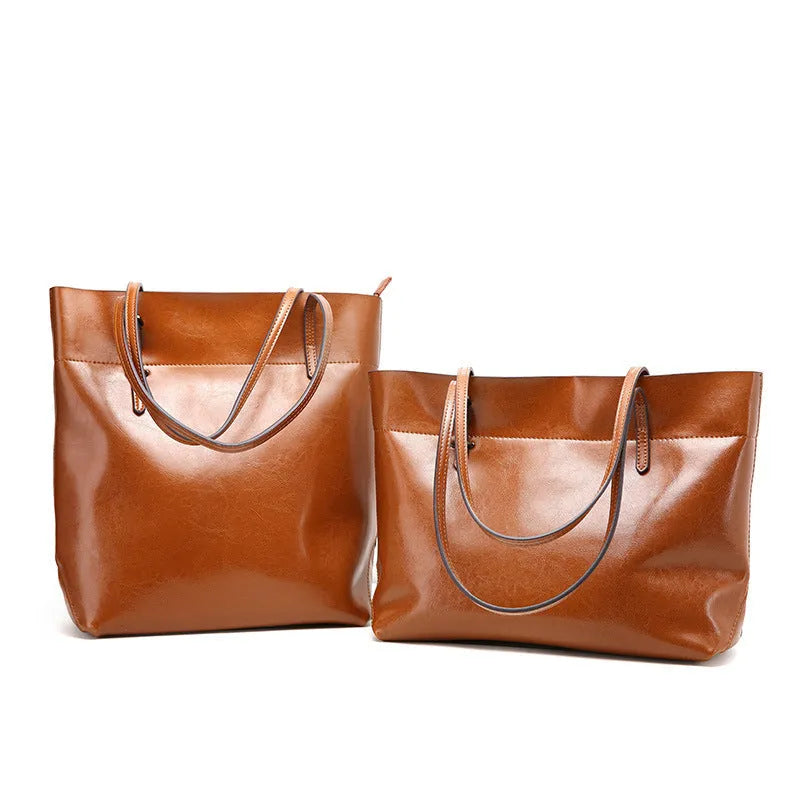 Brown waxed cowhide leather crossbody handbag showing two compartments and phone pocket