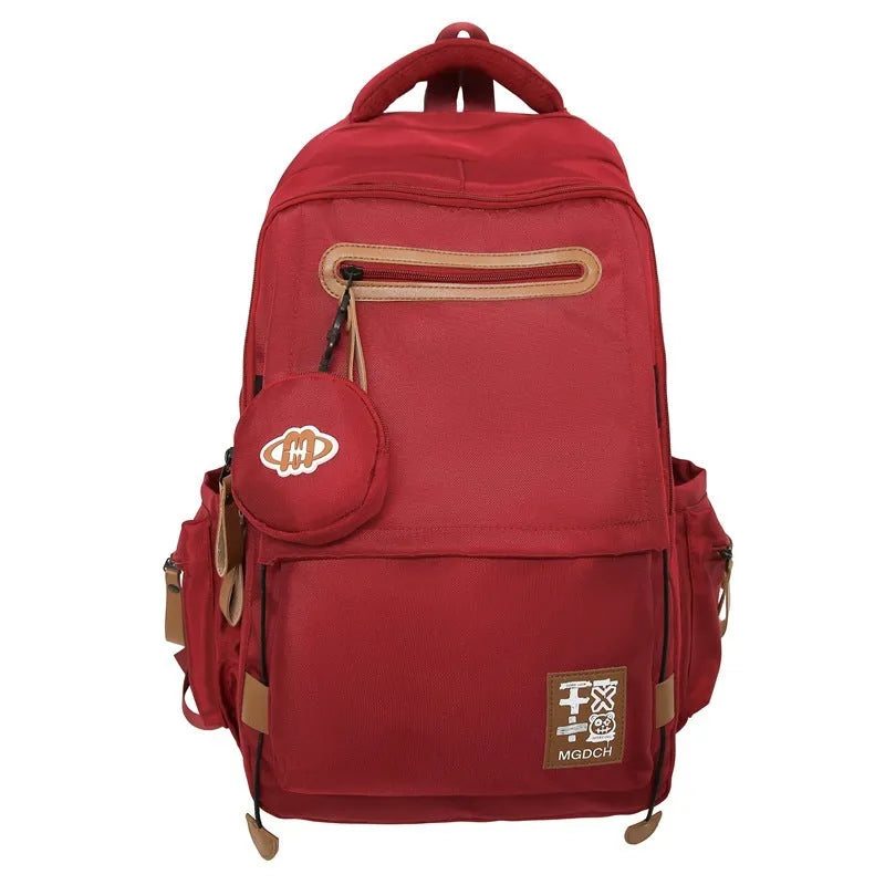 Large nylon backpack for middle school students with curved shoulder straps in solid colour options