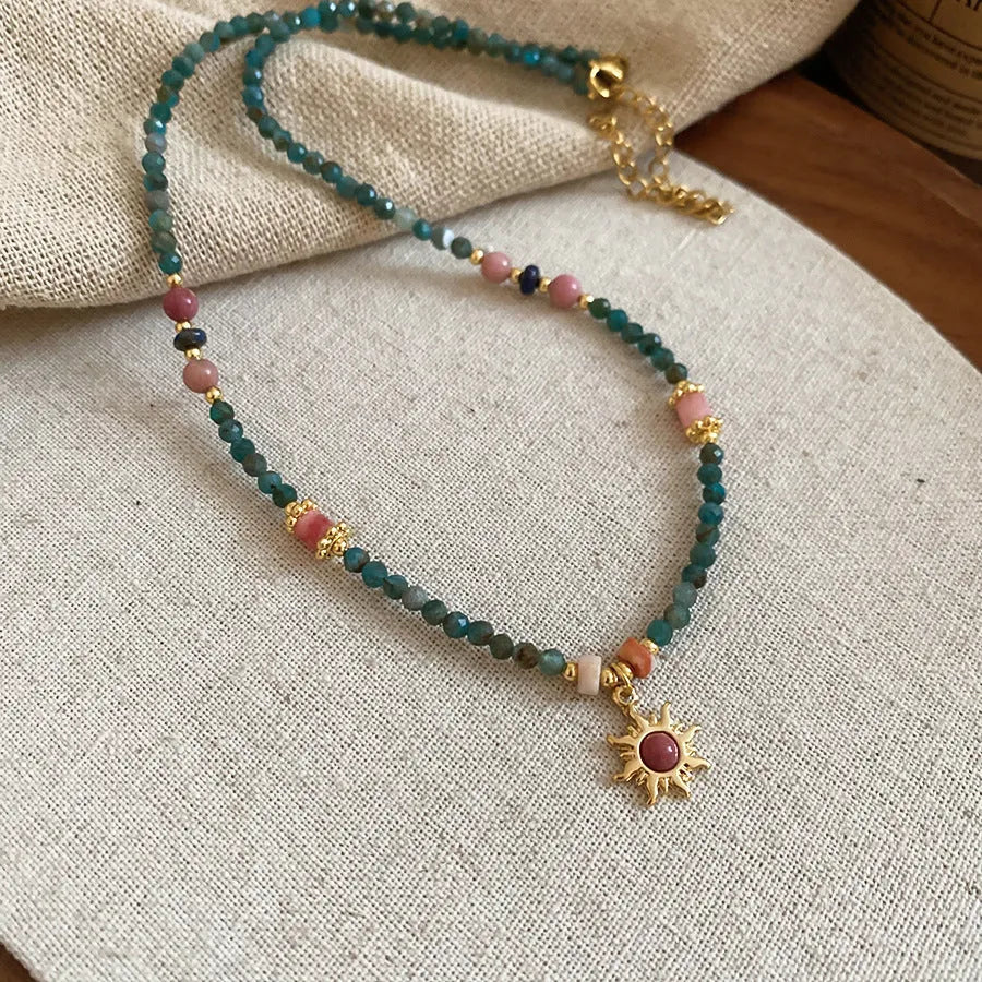 Freshwater pearl necklace with geometric stone sun pendant on clavicle chain