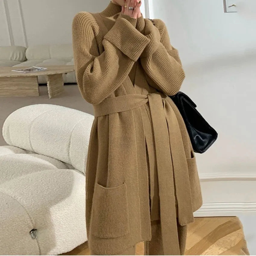 Women's knitted three-piece set showing wide-leg pants, sweater top, and cardigan in solid colour with leather stitching