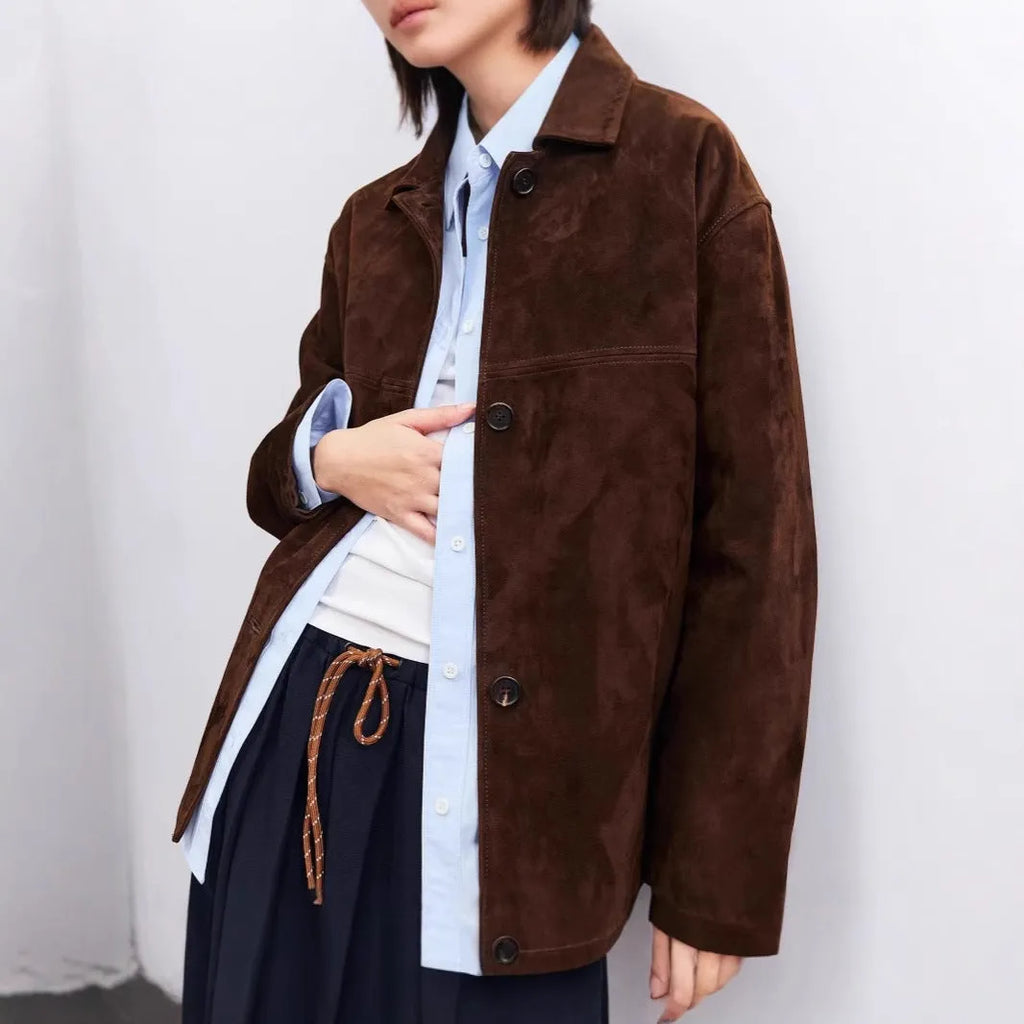 Mid-length cashmere coat with peter pan collar and leather stitching details in yellow brown colour