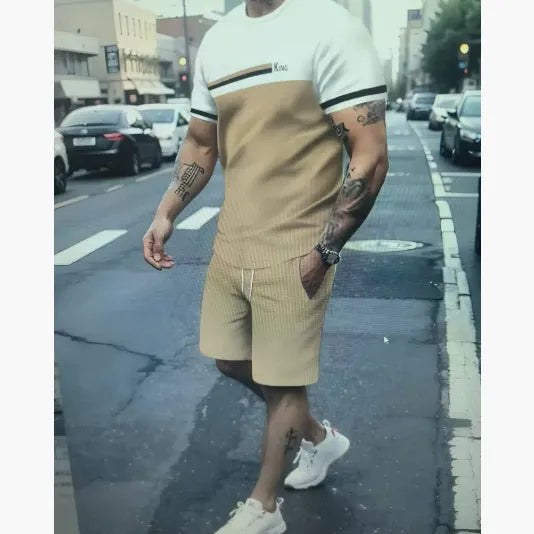 Man wearing a loose fit short sleeve t-shirt and shorts set in a solid colour for summer.