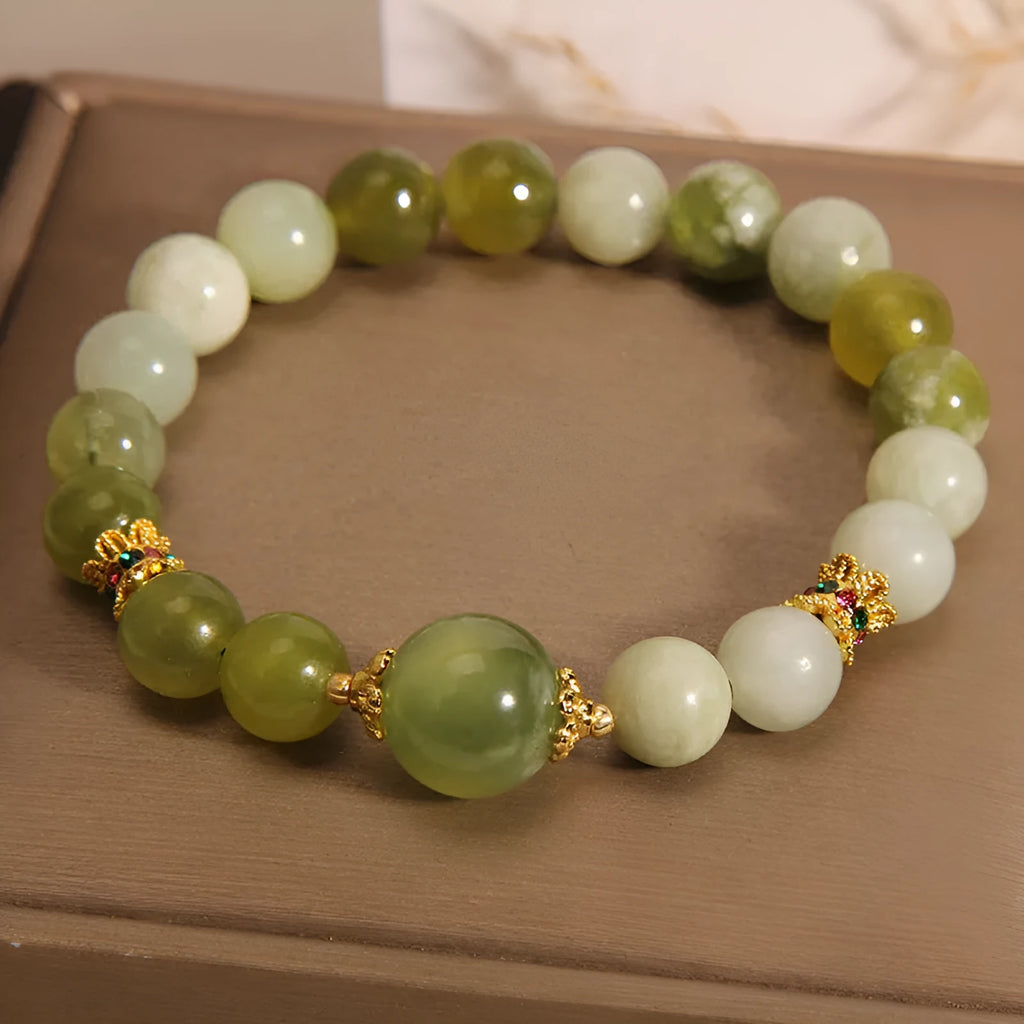 Xiuyan jade green Mori-style women's bracelet on a wrist.