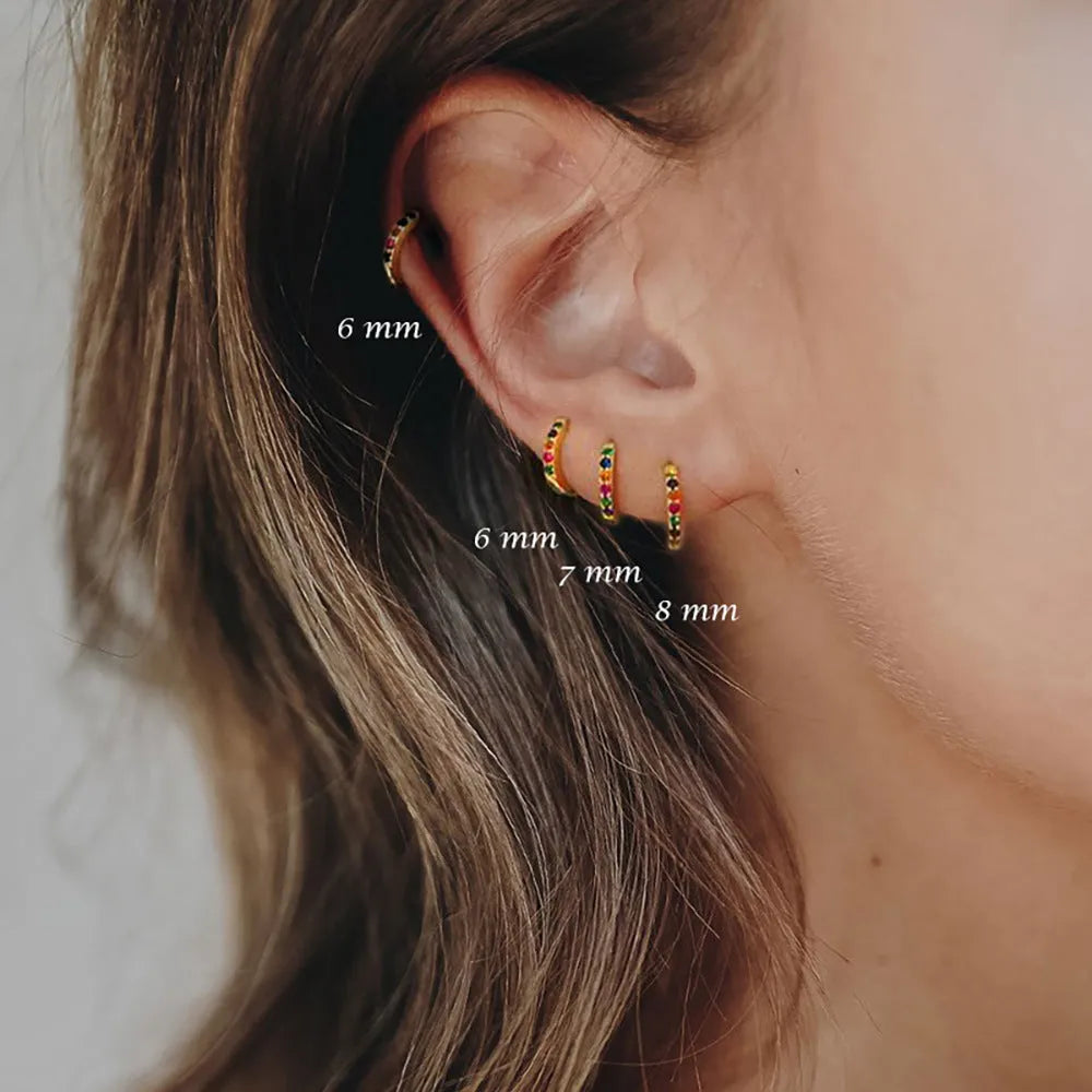 Circle zircon perforated stud earrings in gold, rose gold, and silver colours showing geometric round design with multiple size options