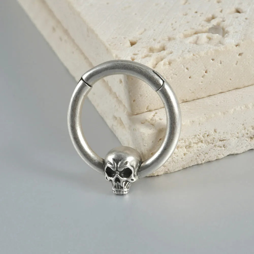 Copper punk earrings with ghost head designs in antique silver or ancient gold finish