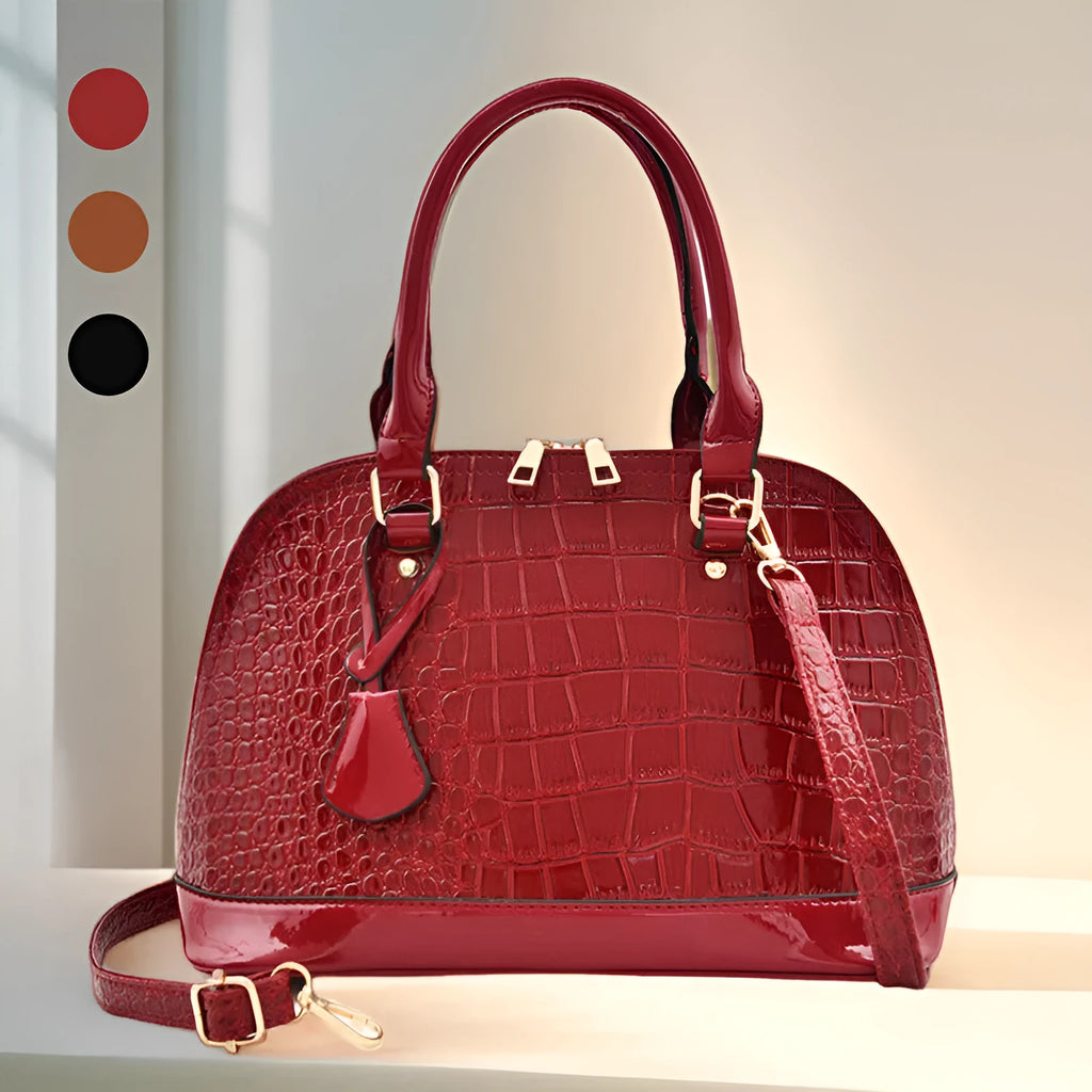 Shiny black PU leather crossbody shoulder bag with a structured shell shape.