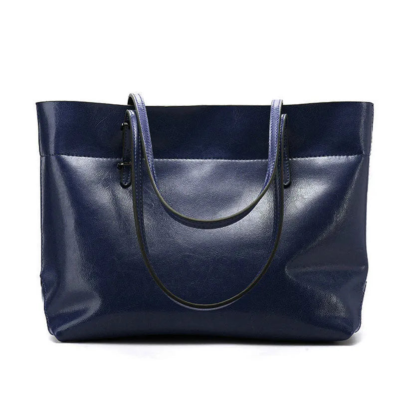 Brown waxed cowhide leather crossbody handbag showing two compartments and phone pocket