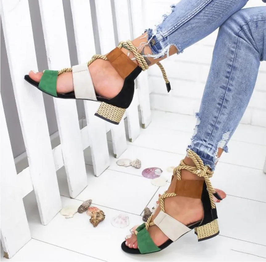Women's beige suede sandals with a chunky heel, colour-block panels, and an ankle strap.