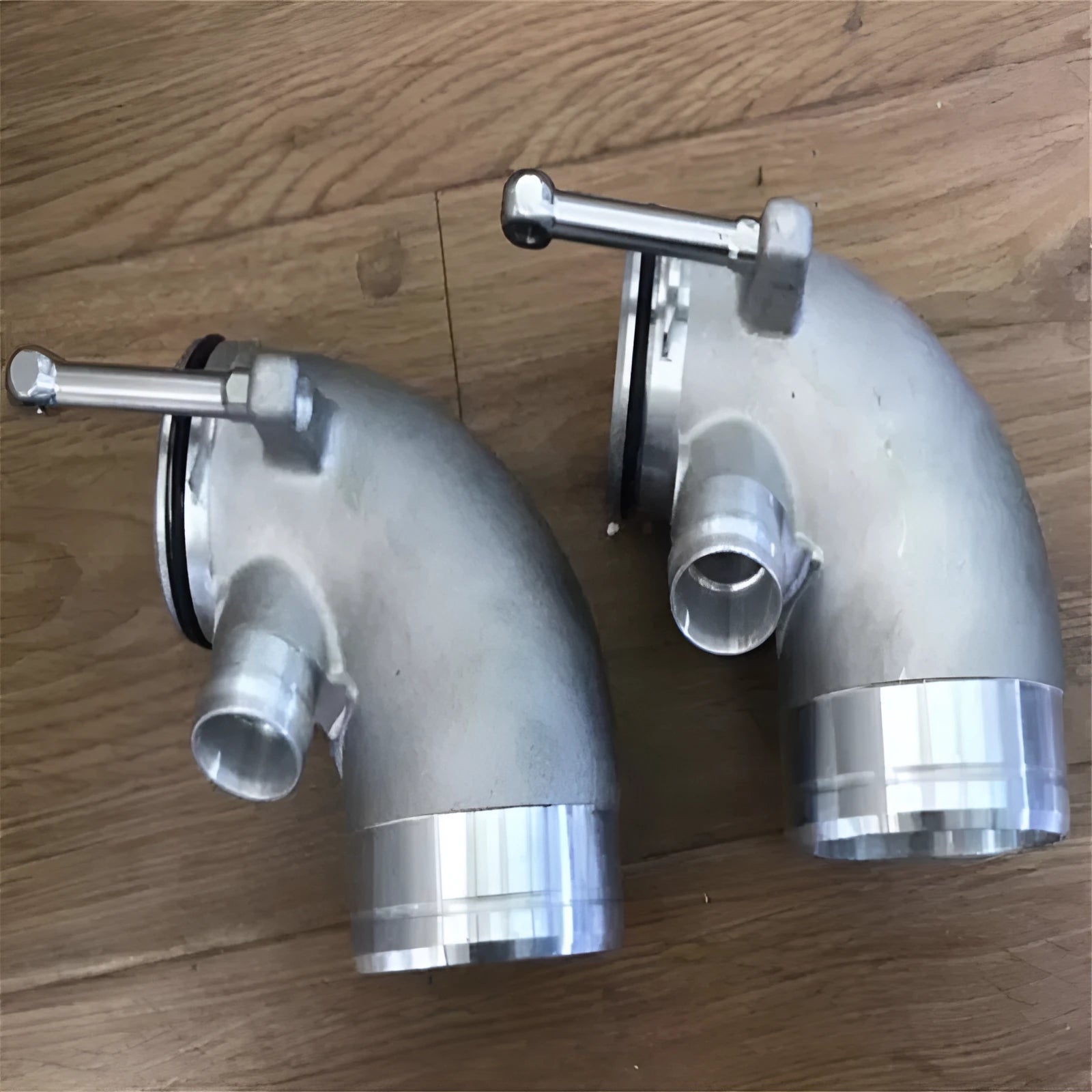 Aluminium alloy 90 degree turbocharger elbow pipe for transverse engine mounting