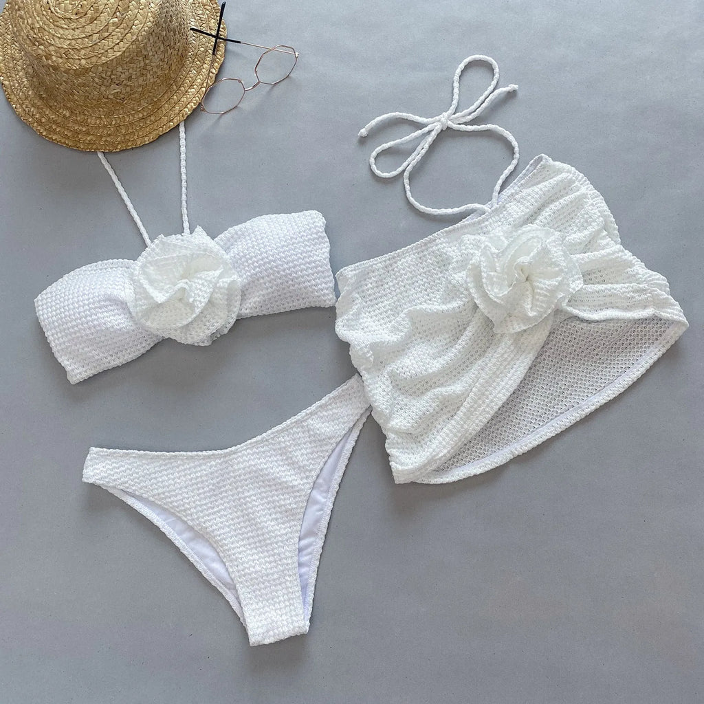Women's three-piece bikini swimsuit set in white or purple with skirt, bra, and briefs