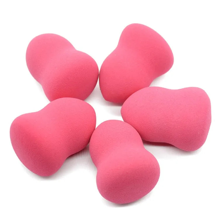 Pink makeup foundation sponge measuring 4cm by 4cm by 5.6cm with soft texture for wet or dry cosmetic application