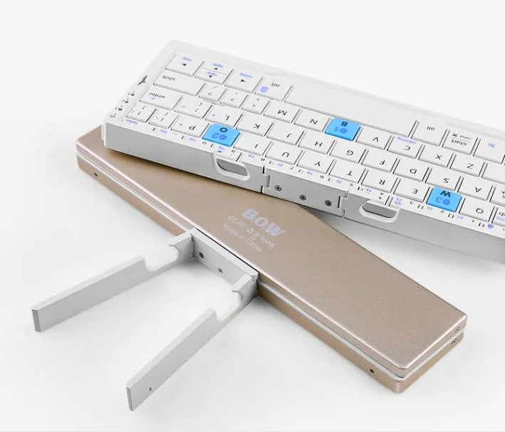 Mini foldable Bluetooth keyboard with aluminium alloy backboard and hidden stands in black