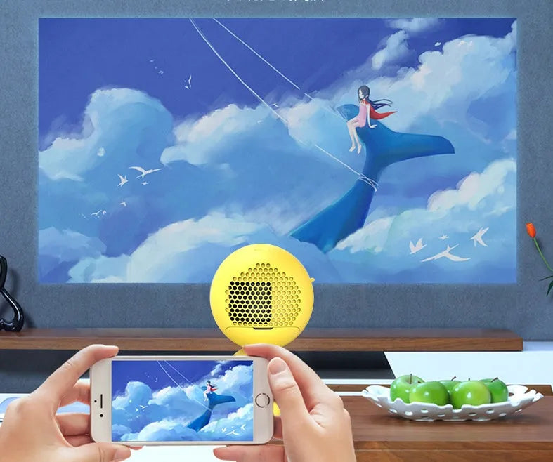 YG220 portable LED projector in white or yellow, showing front lens and compact size.