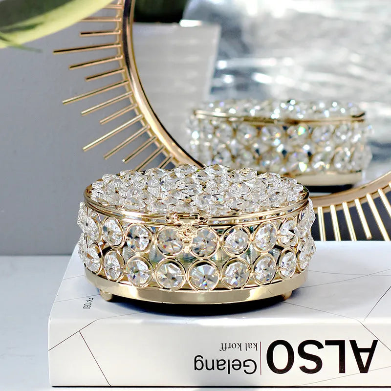 Crystal glass jewellery box with transparent sides and a French gold metal frame.