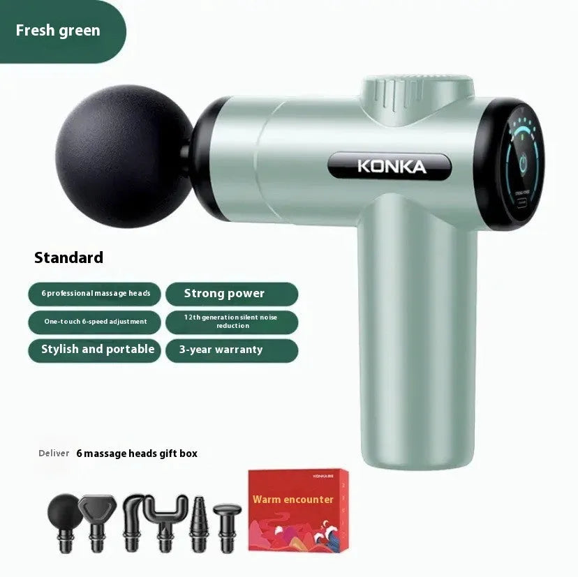 Konka V19 grey mini electric massage gun with multiple attachment heads on a table