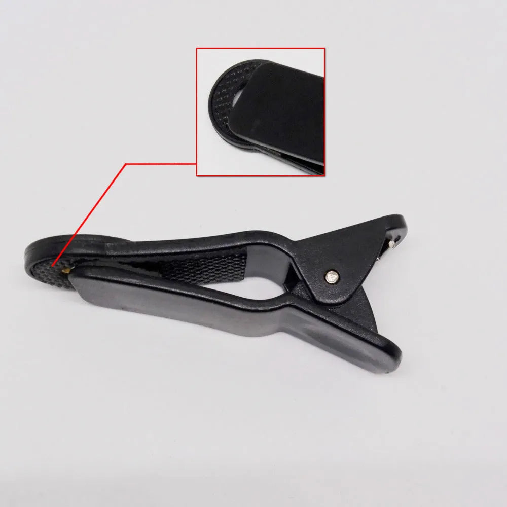 Silver telescopic lens with universal clip for attaching to smartphone for 12x zoom photography