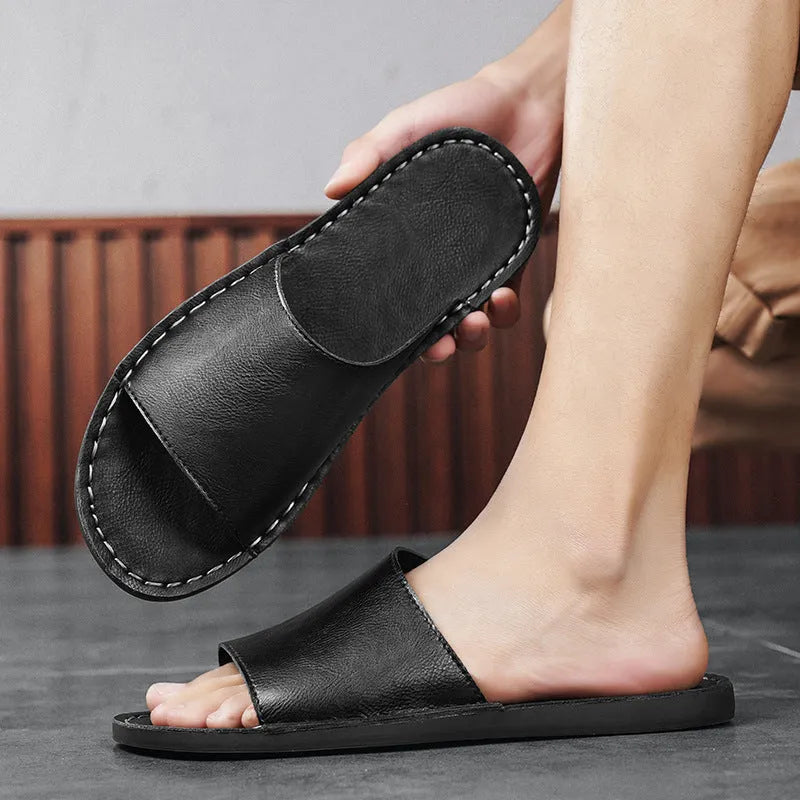 Men's brown leather sandals with adjustable straps and a flat rubber sole on a plain background.