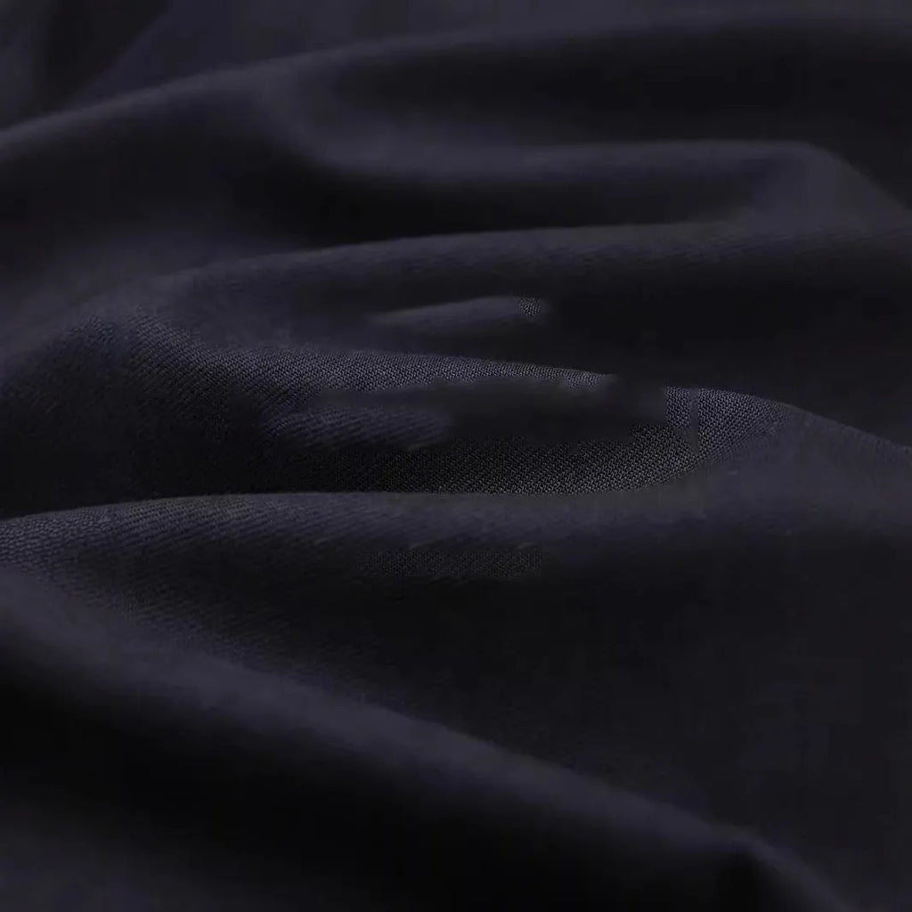 Men's light sand rice casual lapel collar long sleeve shirt on a hanger.