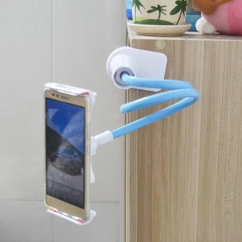 Black bedside oversize flat panel phone holder with a long flexible arm mounted on a table.