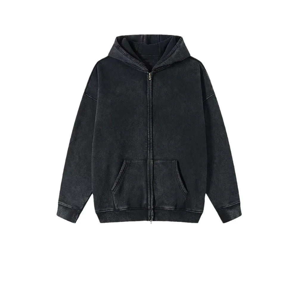 Man wearing a washed black fleece-lined hooded cardigan with a double zipper front.