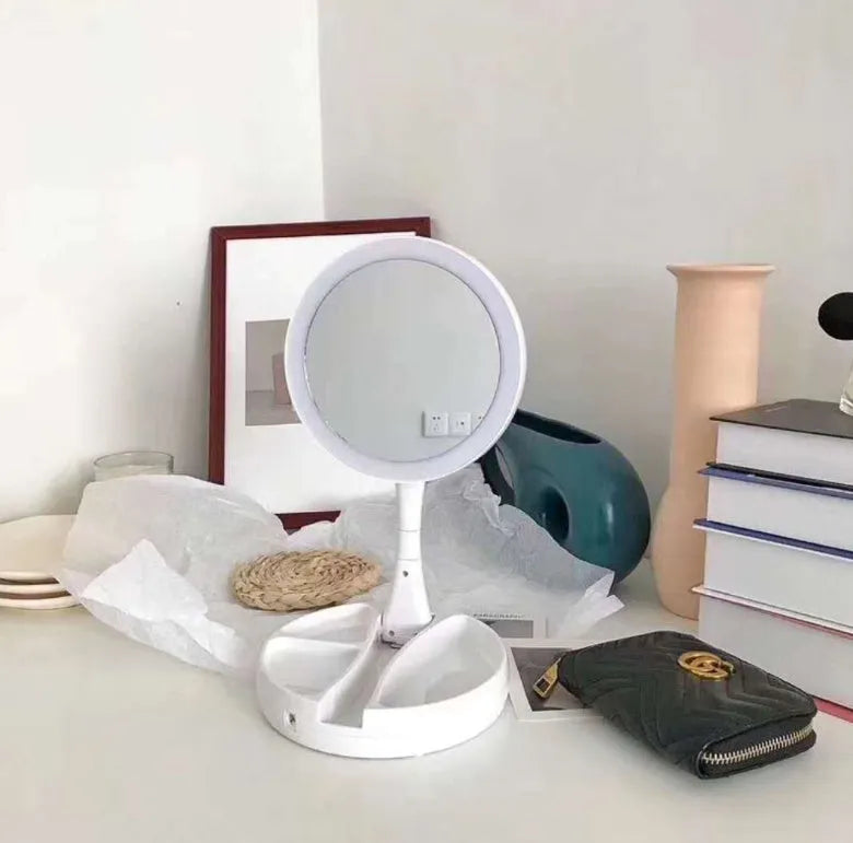 White foldable LED vanity mirror with double-sided magnification and USB charging port