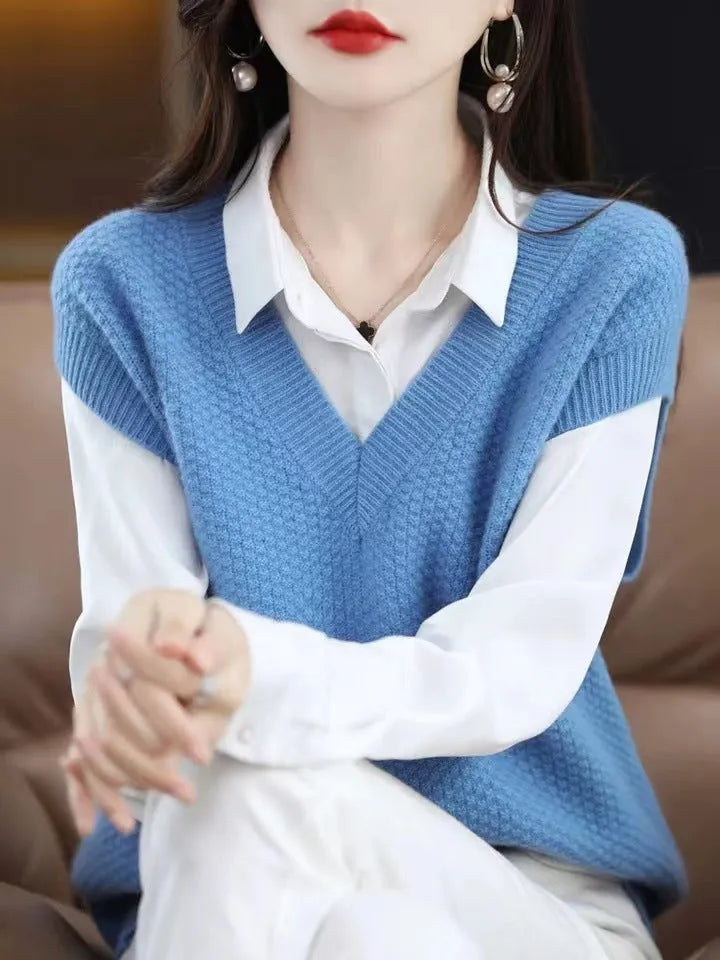 V-neck sleeveless knitted beige vest with a raised 3D pattern, laid flat.