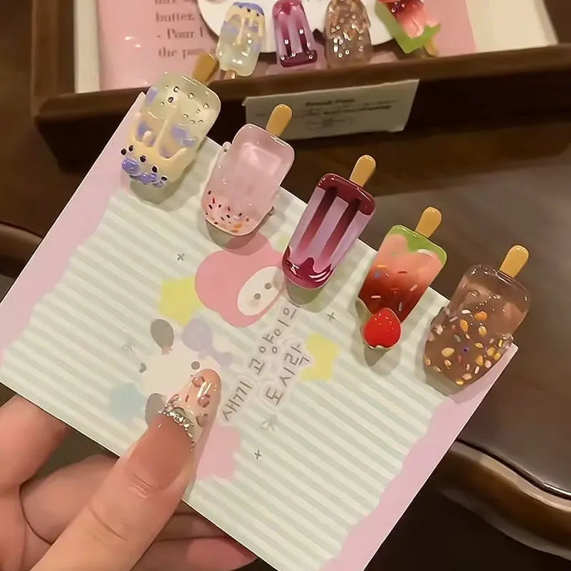 Resin hair barrette featuring a cartoon ice cream design in pink, red, coffee, purple, and beige colour options.