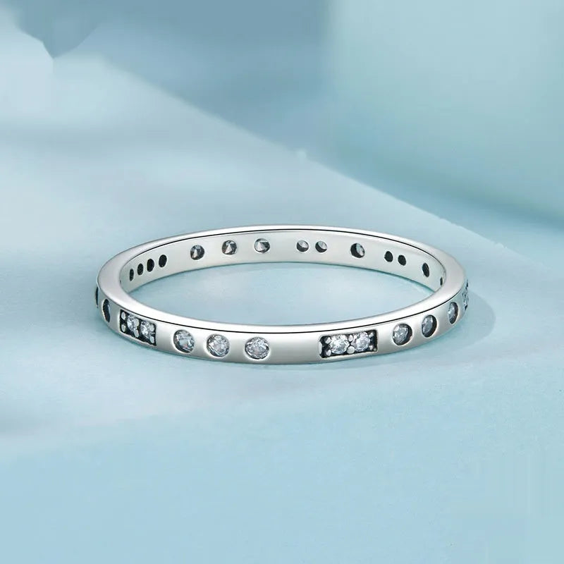 Silver I Love You password ring with oxidised black finish on a simple band, showing script engraving.