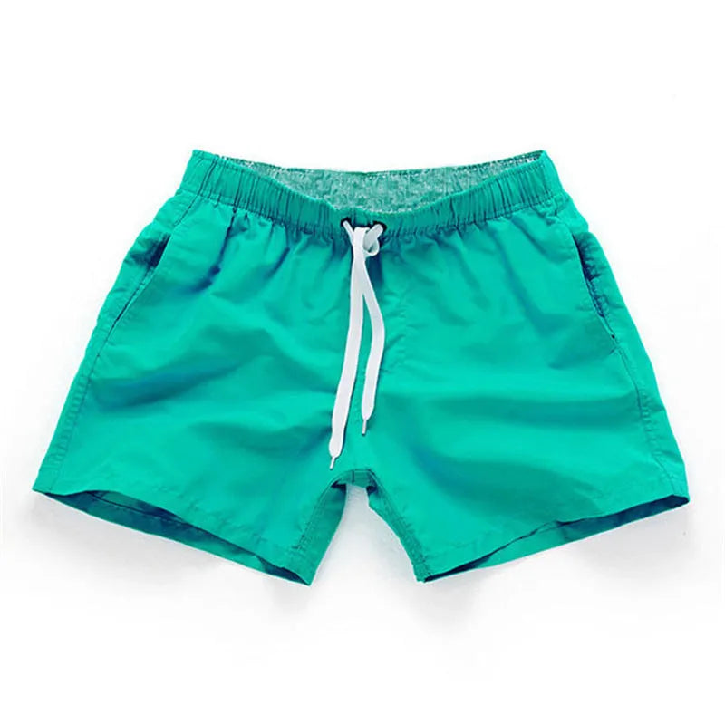 Men's polyester beach shorts in multiple colours with straight leg design for surfing and casual wear