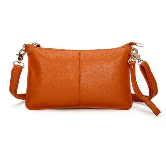 Structured cowhide leather lady slant bag showing front zipper compartment and dual strap options