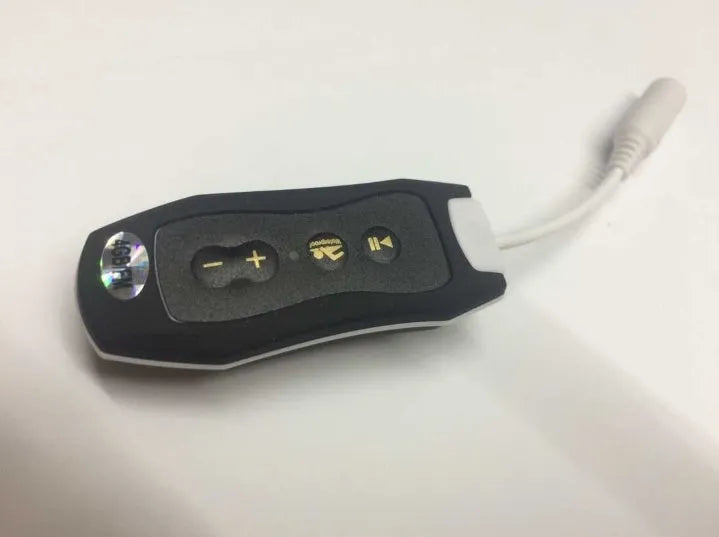 Compact black Bluetooth MP3 player with attached earphones, shown next to a USB cable.